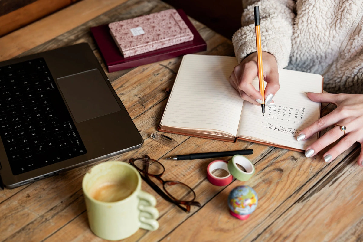  A person writing in a journal by a sunlit window — what is microdosing explained